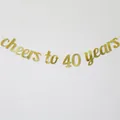 Detail of glittery gold 'cheers to 40 years' banner for birthday party decoration - 40 Years Style / Gold