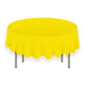 Detail of a bright yellow round PEVA tablecloth hanging naturally on a round table - Yellow