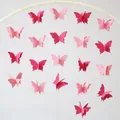Pink 3D butterfly paper garland decoration hanging from a white semi-circle bracket - Small Rose Pink
