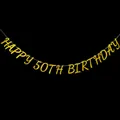 Close-up of golden glitter Happy 50th Birthday banner hanging on black background - Happy 50th Birthday (Gold) / Gold