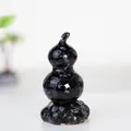 Detailed view of obsidian resin gourd ornament with crystal texture on a sleek gray base - Rotating Style / Revolving Obsidian