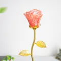 Handmade orange crystal gravel rose ornament with a golden metal stem and leaves - Watermelon Quartz