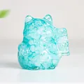 Light blue resin crystal lucky cat figurine with translucent finish and gold details - Aquamarine