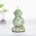 Detailed view of handmade crystal gourd ornament with natural green stone resin infill - Rotating Style / Revolving Green Aventurine