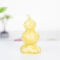 Close-up of a resin gourd ornament filled with yellow natural crystal stones - Rotating Style / Revolving Citrine