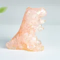Translucent orange resin T-Rex sculpture with embedded natural crystal stones - Rose Quartz
