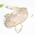 Artistic koi fish statue made of transparent champagne gold crystal with fine carving - Rose Quartz