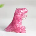 Pink resin crystal dinosaur figurine showing a Tyrannosaurus Rex shape sculpture - Dark Pink