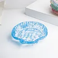 Muschel-Schmuckschale aus Harz mit blauen Naturkristallsteinen für Wohndekoration - Aquamarin