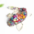 Koi fish ornament made of resin and colorful natural crystal stones on white surface - Colorful Shell