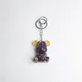 Purple crystal resin bear keychain with gold gears and silver metal clasp detail - Amethyst