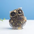Brown and black resin owl figurine with gold leaf accents for home office decor - Tiger's Eye