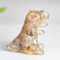 Resin Tyrannosaurus sculpture with citrine crystals and gold leaf details - Rutilated Quartz