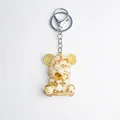 Crystal bear keychain with gold foil and white stones in clear resin on white background - White Shell Style