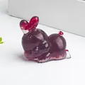 Deep purple resin rabbit figurine with natural crushed crystal and red accent details - Red Glass