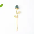 Golden rose craft with green crystal stones inside resin petals on white background - Ruby Zoisite