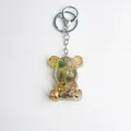 Handmade bear keychain with natural crystal stones, resin, and punk gears decoration - Opalite Style