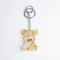 Bear keychain made of clear resin with gold foil flakes and steampunk gear ears - Clear Quartz