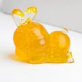 Translucent orange rabbit figurine with crystal stones and a cute bow decoration - Citrine