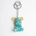 Bear keychain with green crystal stones and gear details in resin with silver clasp - Turquoise