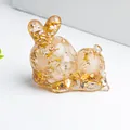 Lying rabbit figurine made of transparent resin with sparkling gold foil flakes - Clear Quartz with Gold Foil