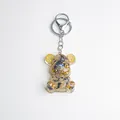 Bear keychain with natural crystals, gold foil, and steampunk gears in resin - Moonstone Style