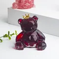 Dark red geometric bear ornament with gold crown featuring a crystal resin finish - Red Glass