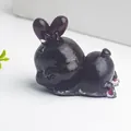 Translucent dark purple resin rabbit figurine with bow and natural crystal gravel - Garnet