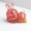 Pink natural crystal rabbit resin figurine with gold leaf accents on white background - Watermelon Quartz with Gold Foil