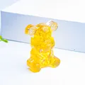 Transparent yellow resin bear figurine with natural crystal stone and metal gear ears - Citrine