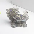 Detail of crystal resin Dragon Turtle statue with iridescent glitter and clear texture - Labradorite
