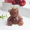 Translucent magenta crystal bear with crown and gold foil flakes interior detail - Strawberry Quartz + Gold Foil