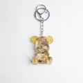 Mechanical style resin bear keychain with gold gears and brown crystal stone fill - Rutilated Quartz Style
