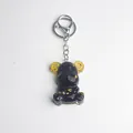 Handmade black resin bear keychain with gold foil flakes and steampunk gear ears decoration - Obsidian