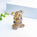 Resin bear figurine filled with gold foil and colorful natural crystal stones - Rutilated Quartz With Gold Foil