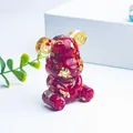 Artistic handmade resin bear figurine filled with red crystal chips and gold foil - Deep Sea Caterpillar