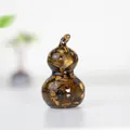 Handcrafted resin Wu Lou ornament filled with natural Tiger's Eye stones in brown and gold - Tiger's Eye