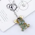 Bear keychain with green natural crystal stones and gold foil inside resin pendant - Aventurine Style