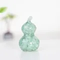 Resin crystal gourd figurine in light green finish with natural gemstone fillings - Aquamarine
