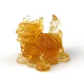 Golden dragon turtle statue with amber resin and crystal stone on white background - Citrine
