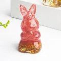 Translucent red resin rabbit ornament with embedded gold leaf foil flakes on base - Watermelon Quartz with Gold Foil