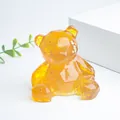 Ours décoratif en résine ambrée avec feuilles d'or et design géométrique à facettes - Citrine