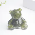 Ours en cristal et résine avec pierres péridot vertes et design géométrique épuré - Péridot