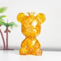 Goldene Bärenfigur mit Krone und funkelndem Bernstein-Kristall im Inneren - Citrin Stil