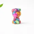 Macro detail of a colorful crystal resin schnauzer figurine with vibrant textures - Abalone Shell