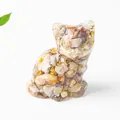 Macro shot of resin cat figurine featuring embedded natural crystals and gold foil flakes - 3.2cm x 3.3cm x 4cm / Crazy Agate