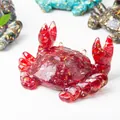 Detailed macro of a red resin crab figurine with gold leaf foil interior decoration - Red Glass