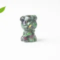 Macro shot of Schnauzer statue made of natural green and black crystal stones resin - Ruby Zoisite