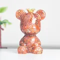 Kunstvolle Bärenfigur mit roten Kristallsteinen und Goldfolie im Harzkörper - Roter Achat-Stil