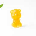 Macro shot of Schnauzer dog ornament crafted with amber resin and natural crystal stones - Citrine